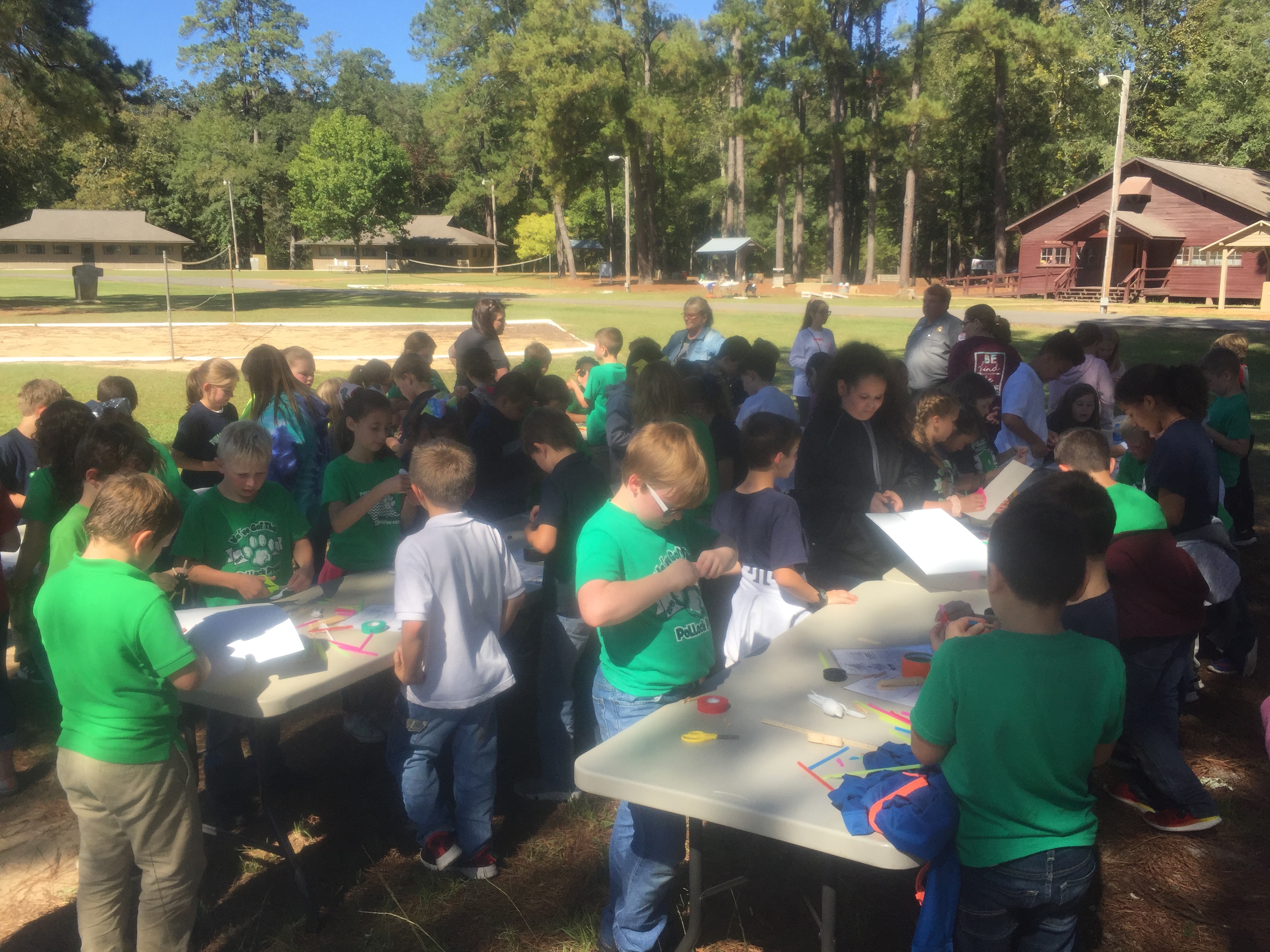 Youth at tables perform creative activities.JPG thumbnail